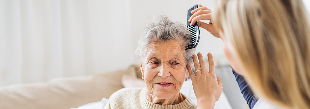 a woman getting her hair brushed